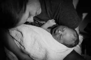 David and Vanessa, just after birth. Dad caught the baby before the midwife and doula could arrive! Photo courtesy of Sacred Hour Doula and Photography, 2014.