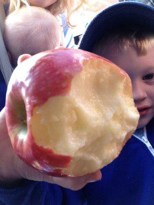 He licked this apple, after finding it on the street at a parade. 
