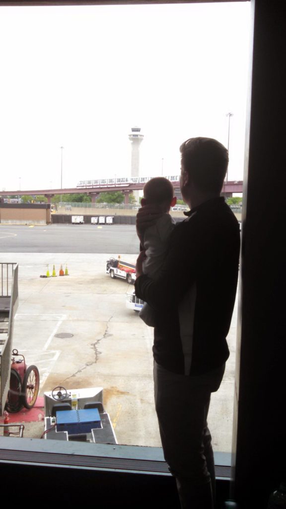 My oldest son and his dad, looking at planes while waiting for his 1st flight. We went to Ithaca, NY for my cousin's graduation from Cornell. My son still loves looking at the planes at the airport.