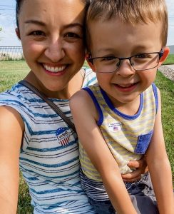 woman and her son wearing "I voted" and "Future voter" stickers