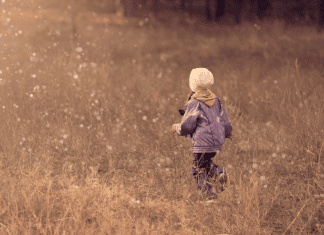 kid walking in field