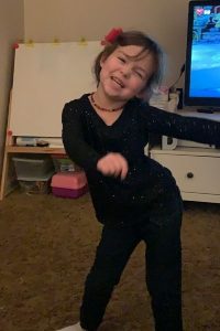 young girl dancing the floss