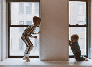 two kids playing inside