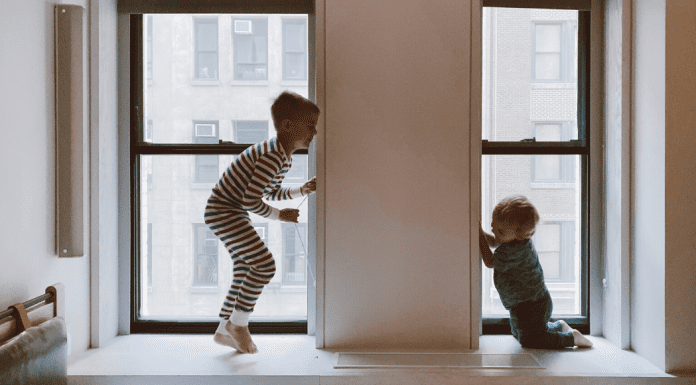two kids playing inside