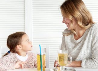pic of mom and daughter sitting at a table
