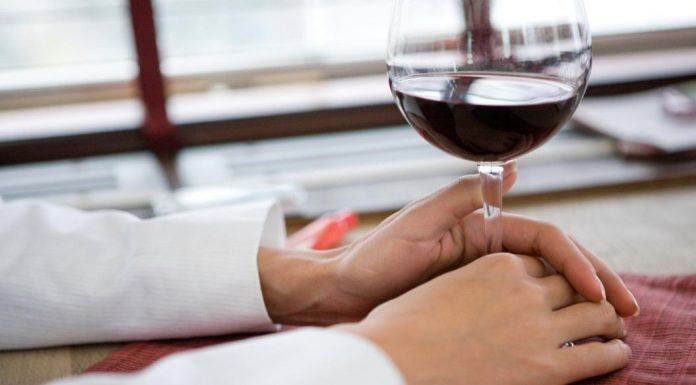 pic of woman's hands holding glass of wine