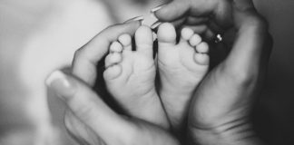 pic of baby feet held in mother's hands