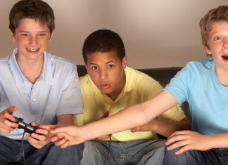 pic of three boys playing video games