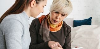 pic of woman with aging mother looking at tablet