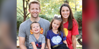 family pic: man, woman, boy, and girl in KC shirts