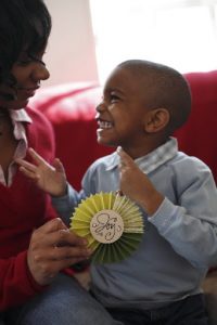 4-year-old boy smiling at his mother