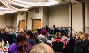 a crowded luncheon about women in leadership