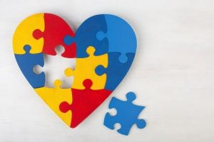 heart made of different colored puzzle pieces