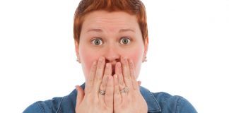 woman covering her mouth, like in an "oops"