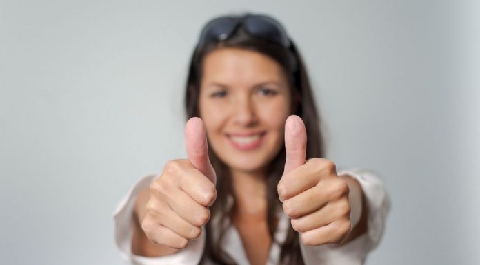 woman giving two thumbs up
