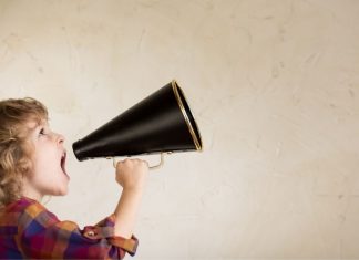 kid speaking out of a megaphone