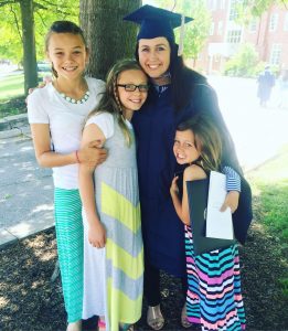 mom at graduation with daughters