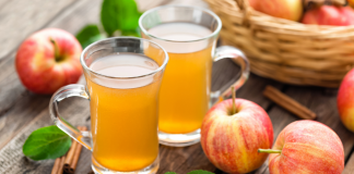 glasses of apple cider and apples
