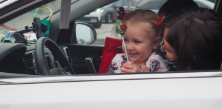 little girl at drive thru Santa