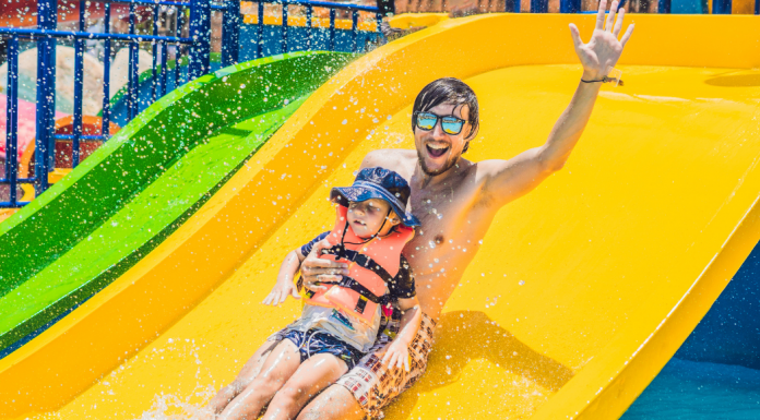 dad and son on water slide
