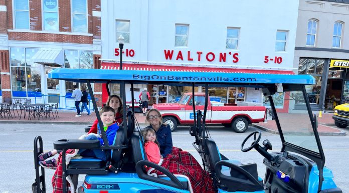 family on cart outside Waltons in Bentonville