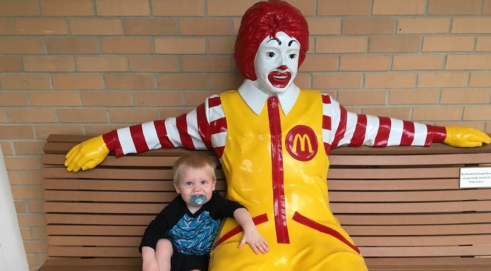 boy with Ronald McDonald statue