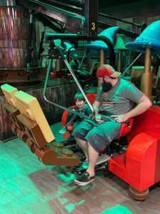Dad and son riding Legoland attraction