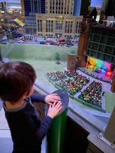 child watching rock concert made out of Legos