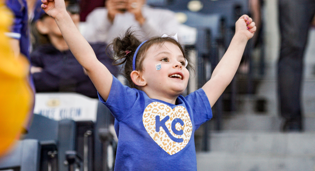 little girl cheering for Royals at Kauffman Stadium