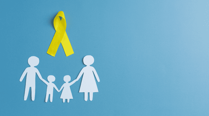 Paper doll family with yellow suicide prevention ribbon