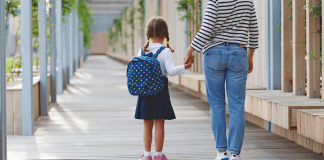 mom and kid walking to school