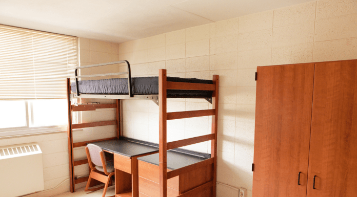 college dorm room with bed
