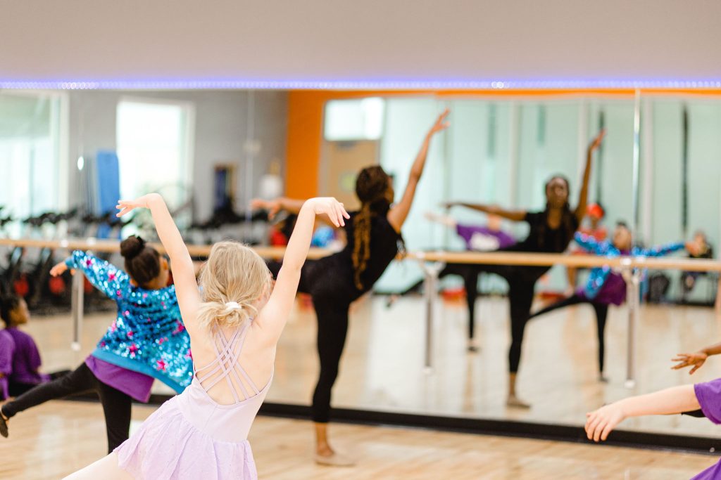 Young dancers in class in front of mirror