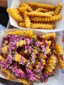 Fries topped with pink sauce