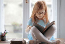 girl reading chapter book